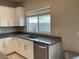 Bright kitchen features granite counters, stainless steel appliances, and white cabinets at 4243 Sago Lily St, Las Vegas, NV 89129