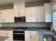 Modern kitchen featuring a gas cooktop and a stainless steel microwave and oven at 4243 Sago Lily St, Las Vegas, NV 89129