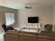 Spacious living room with modern furnishings and a ceiling fan at 4243 Sago Lily St, Las Vegas, NV 89129