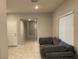 Cozy living room with tile flooring and ample natural light, perfect for relaxing at 4243 Sago Lily St, Las Vegas, NV 89129