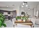 Bright dining area open to the kitchen featuring a table set with seating and stainless steel appliances at 4438 Faberge Ave, Las Vegas, NV 89115