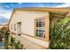 Beige single-story home featuring a garden, windows, and a sidewalk at 4438 Faberge Ave, Las Vegas, NV 89115