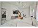 Bright living room features a modern fireplace, white tile floors, and a comfortable, stylish white sectional sofa at 4438 Faberge Ave, Las Vegas, NV 89115