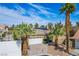 Overhead shot of a property showcasing the roof, front yard and landscaping, bathed in sunny skies at 4574 Sheri Lyn Ct, Las Vegas, NV 89121