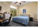 Bedroom with natural lighting featuring a bed, desk, and drawers with tv hookups at 4574 Sheri Lyn Ct, Las Vegas, NV 89121