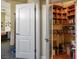 Neatly organized shelving in closet with built-in storage for book and media collections at 4574 Sheri Lyn Ct, Las Vegas, NV 89121