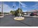 View of the secure gated entrance to the residential community with lush landscaping at 4574 Sheri Lyn Ct, Las Vegas, NV 89121