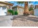 Well-kept house with a desert landscaped front yard and a glimpse of its architectural details at 4574 Sheri Lyn Ct, Las Vegas, NV 89121