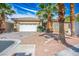 Attractive home with a two-car garage and lush landscaping, showcasing its inviting curb appeal at 4574 Sheri Lyn Ct, Las Vegas, NV 89121