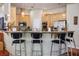 Open concept kitchen with granite countertops, stainless steel appliances, and bar seating at 4574 Sheri Lyn Ct, Las Vegas, NV 89121