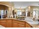 Functional kitchen featuring a double sink, hanging lights, and wooden cabinets, perfect for culinary enthusiasts at 4574 Sheri Lyn Ct, Las Vegas, NV 89121