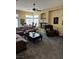 Comfortable living room with a ceiling fan and a cozy fireplace, perfect for relaxation and gatherings at 4574 Sheri Lyn Ct, Las Vegas, NV 89121