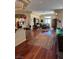 Spacious living room with hardwood floors, a dining area, and a breakfast bar for entertaining guests at 4574 Sheri Lyn Ct, Las Vegas, NV 89121
