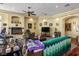Bright living room featuring a fireplace, a TV, and a green blanket, providing a stylish and comfortable setting at 4574 Sheri Lyn Ct, Las Vegas, NV 89121