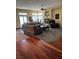 Open-concept living room with hardwood floors and a fireplace, blending style and functionality for modern living at 4574 Sheri Lyn Ct, Las Vegas, NV 89121