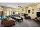 Inviting living room featuring neutral colors, abundant natural light, and a comfortable seating area at 4574 Sheri Lyn Ct, Las Vegas, NV 89121