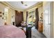 Relaxing bedroom featuring ample natural light and access to outdoor pool at 4574 Sheri Lyn Ct, Las Vegas, NV 89121