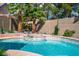 Gorgeous backyard pool with a spa, complemented by well-maintained landscaping and privacy walls at 4574 Sheri Lyn Ct, Las Vegas, NV 89121