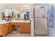 Bathroom with a glass shower, wood cabinets, double mirrors, and white countertops at 5433 Honey Mesquite Ln, Las Vegas, NV 89130