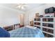Bedroom featuring wood-style floors, neutral paint, and plenty of storage at 5433 Honey Mesquite Ln, Las Vegas, NV 89130