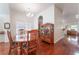 Elegant dining room featuring a wood table, wood floors, and natural light at 5433 Honey Mesquite Ln, Las Vegas, NV 89130