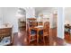 Dining room with wood table, china cabinet, and wood flooring at 5433 Honey Mesquite Ln, Las Vegas, NV 89130