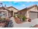 Charming single-story home featuring desert landscaping and a two-car garage at 5433 Honey Mesquite Ln, Las Vegas, NV 89130