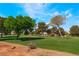 Picturesque view of the lush green golf course surrounded by mature trees at 5433 Honey Mesquite Ln, Las Vegas, NV 89130
