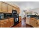 Well-lit kitchen features stainless appliances and granite countertops at 5433 Honey Mesquite Ln, Las Vegas, NV 89130