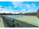 Well-maintained tennis court facility with blue and green courts, lighting, and seating at 5433 Honey Mesquite Ln, Las Vegas, NV 89130