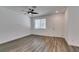 Spacious living area featuring modern flooring, a ceiling fan, and a welcoming front door at 5730 Sky Pointe Dr # 165, Las Vegas, NV 89130