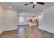 Open-concept living space with modern flooring, white cabinets, and stainless steel appliances at 5730 Sky Pointe Dr # 165, Las Vegas, NV 89130