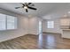 Open-concept living space with modern flooring, recessed lighting and sliding glass door at 5730 Sky Pointe Dr # 165, Las Vegas, NV 89130