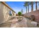 Private backyard featuring a stone pathway and mature trees, offering a peaceful outdoor setting at 6022 Quintillion Ave, Las Vegas, NV 89122