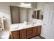Bathroom featuring a double sink vanity, large mirror, and tile flooring at 6022 Quintillion Ave, Las Vegas, NV 89122