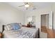 Cozy bedroom with a ceiling fan, closet with sliding mirrored doors, and carpeted floor at 6022 Quintillion Ave, Las Vegas, NV 89122