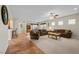 Spacious living area featuring comfortable seating, neutral tones, and seamless flow to kitchen at 6022 Quintillion Ave, Las Vegas, NV 89122