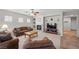 Cozy living room featuring a fireplace, comfortable seating, and abundant natural light at 6022 Quintillion Ave, Las Vegas, NV 89122