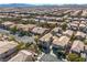 Expansive aerial view of a residential neighborhood featuring well-maintained homes and lush landscaping at 6653 Ashley House Ct, Las Vegas, NV 89139