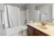 Bathroom featuring a shower-tub combo, toilet, vanity, and towel rack at 6653 Ashley House Ct, Las Vegas, NV 89139