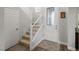 Bright entryway featuring a carpeted staircase, a decorative front door, and neutral walls at 6653 Ashley House Ct, Las Vegas, NV 89139