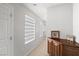 Hallway features multiple windows with blinds and a built-in dark wood cabinet at 6653 Ashley House Ct, Las Vegas, NV 89139