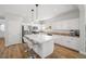 Spacious kitchen with stainless steel appliances, white cabinets, and a large center island at 6653 Ashley House Ct, Las Vegas, NV 89139