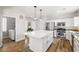 Bright kitchen with white cabinetry, stainless steel appliances, and large kitchen island at 6653 Ashley House Ct, Las Vegas, NV 89139