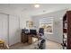 Office with neutral walls and carpet featuring desk, cabinets and closet with double doors at 6653 Ashley House Ct, Las Vegas, NV 89139
