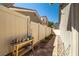 Side yard with a well-manicured pathway and decorative items adding charm to the outdoor space at 6653 Ashley House Ct, Las Vegas, NV 89139