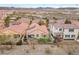 Aerial shot of a home with solar panels, featuring a landscaped backyard with an outdoor patio area at 69 Via Di Mello, Henderson, NV 89011