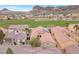 An aerial view highlighting the community's architecture, with focus on a home with solar panels at 69 Via Di Mello, Henderson, NV 89011
