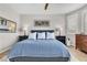 Inviting bedroom featuring a comfortable bed, stylish furnishings, and ample natural light from the window at 69 Via Di Mello, Henderson, NV 89011