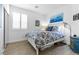 Bright bedroom with a comfortable bed, stylish bedding, and natural light from the window at 69 Via Di Mello, Henderson, NV 89011